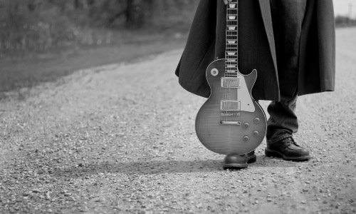 John Hern and close-up of his guitar